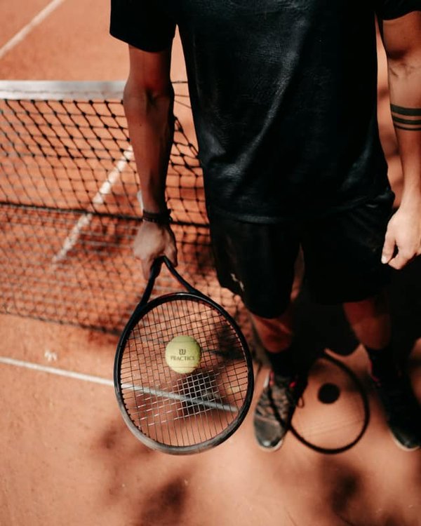 How is technology being used to improve the accuracy of line calls in racquet sports?